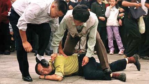 FalunGong Eve of Persecution Stepping on head2 1 1024x576